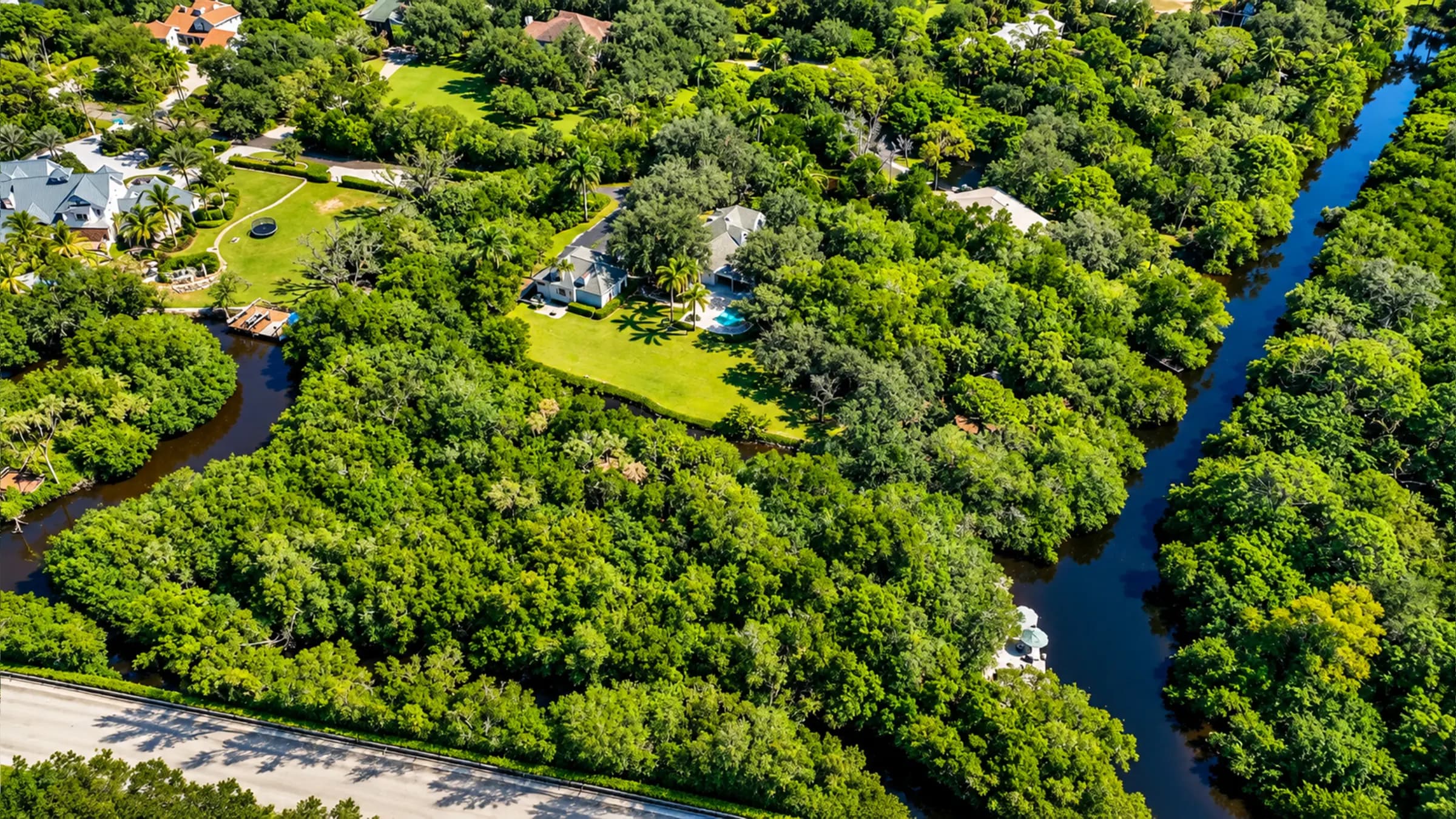 The Cocohatchee River bending past the property's private islands